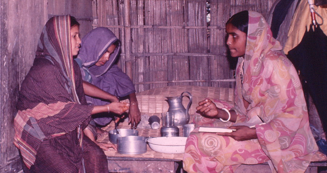 A BRAC community health worker teaches mothers how to make oral rehydration solution at home to treat their children for diarrheal diseases
